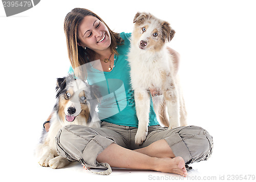 Image of australian shepherds and woman
