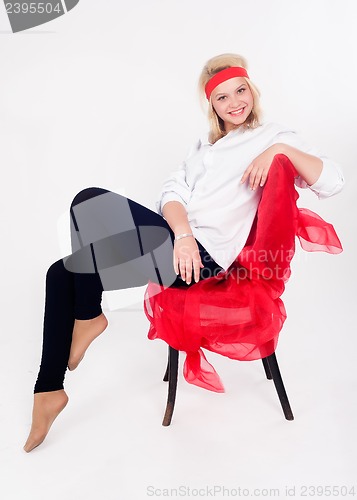 Image of Pretty girl relaxing on chair