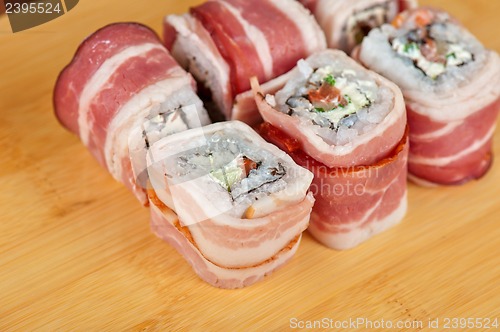 Image of Sushi roll with bacon