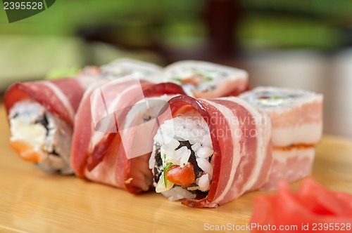 Image of Sushi roll with bacon