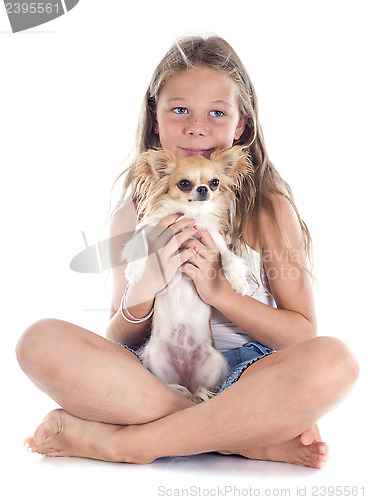 Image of child and chihuahua