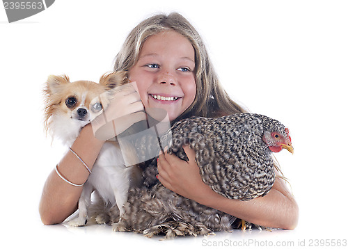 Image of child, dog and chicken