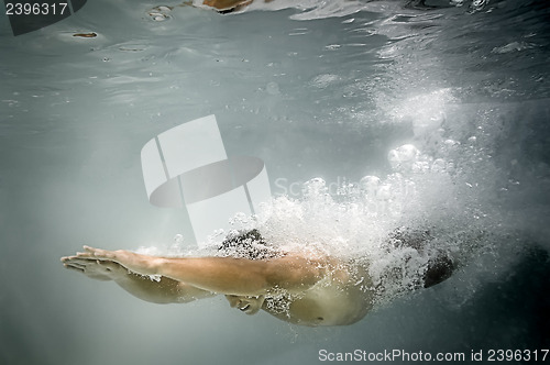 Image of male pool diving