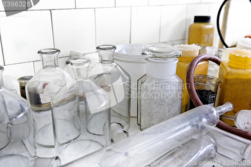 Image of Photo of an old laboratory with a lot of bottles