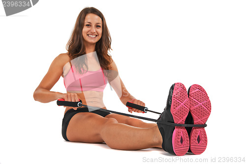 Image of Young woman in the studio streching