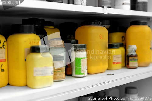 Image of Photo of an old laboratory with a lot of bottles