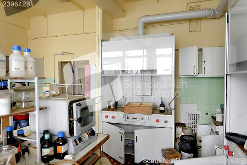 Image of Photo of an old laboratory with a lot of bottles