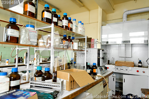 Image of Photo of an old laboratory with a lot of bottles