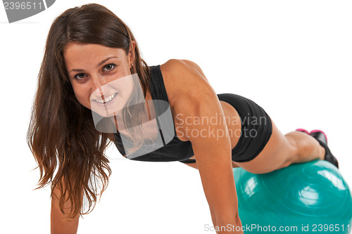 Image of Young woman in the studio with fitness ball