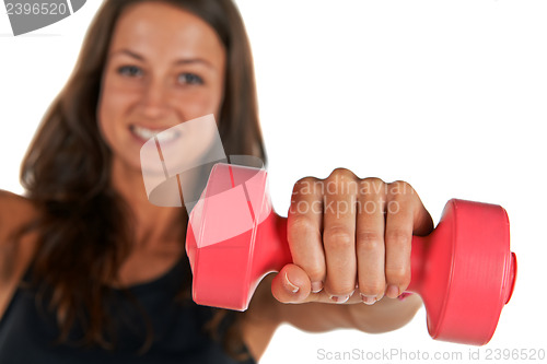 Image of Young woman in the studio with weights