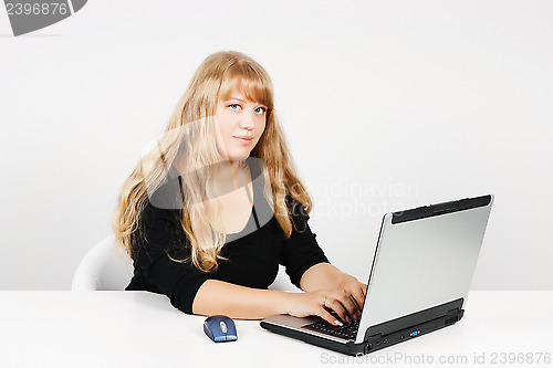 Image of attractive girl with a laptop