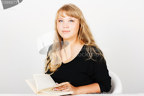 Image of Attractive girl with a book