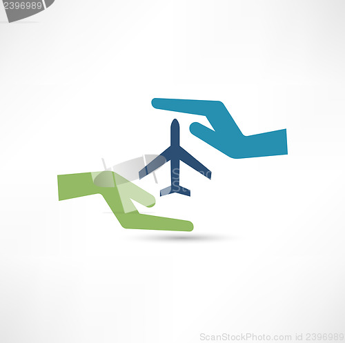 Image of Hands and aircraft. The concept of safe flight.
