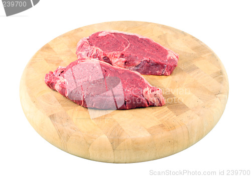 Image of Steaks on a chopping board