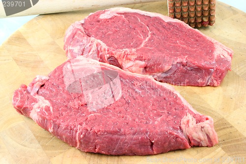 Image of Steaks on a chopping board