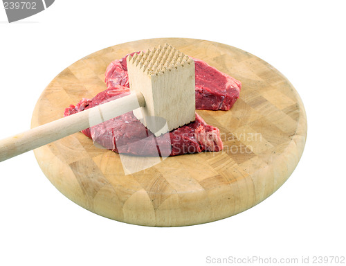 Image of Steaks on a chopping board with Mallet
