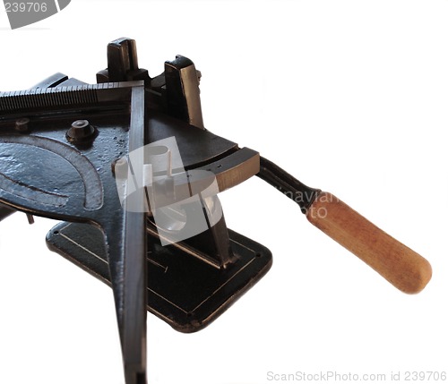 Image of mitering machine showing knife handle