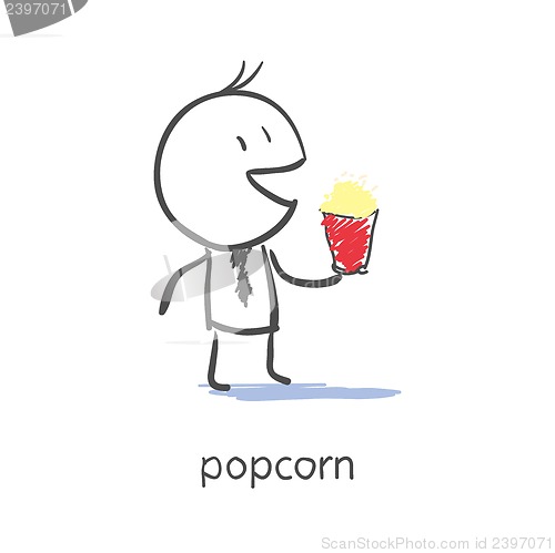 Image of Businessman eating popcorn