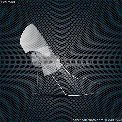 Image of  glass shoe on a metal background