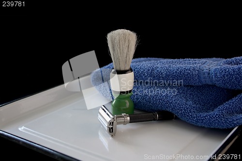 Image of razor and shaving brush