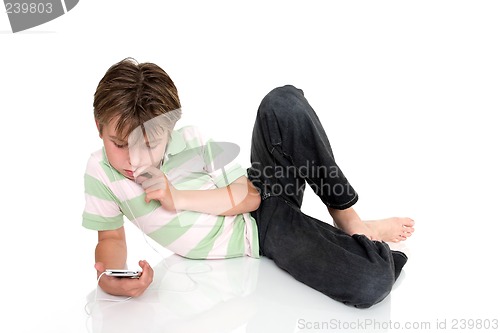 Image of Child relaxing with an electronic gadget