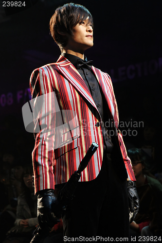 Image of Asian male model on the catwalk