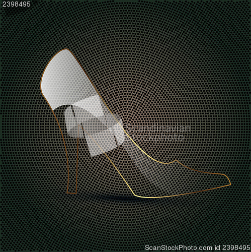 Image of glass shoe on a metal background