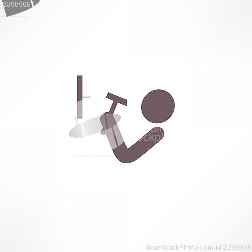 Image of man hits the nail with a hammer icon