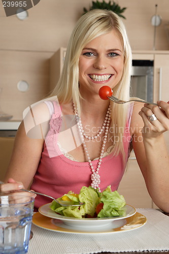 Image of Woman eating salad