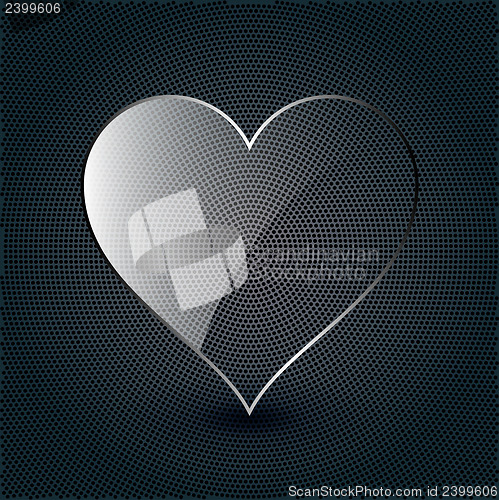 Image of glass heart on a metal background