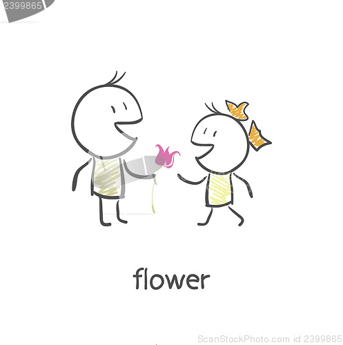 Image of The guy gives a girl a flower