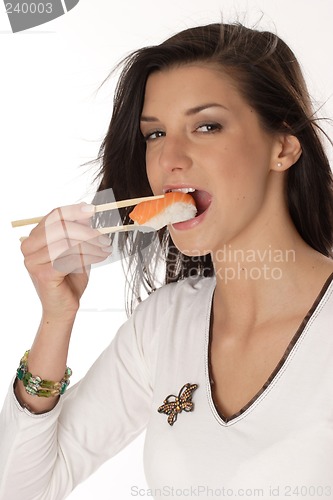 Image of Woman eating sushi