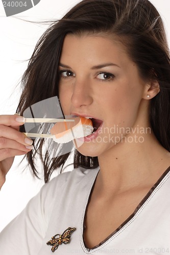 Image of Woman eating sushi