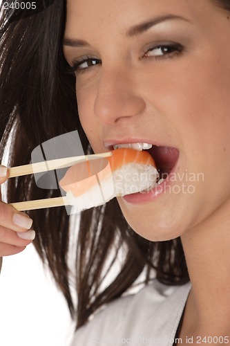 Image of Woman eating sushi