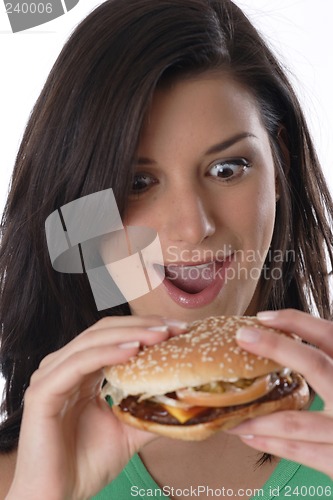 Image of Woman eating burger