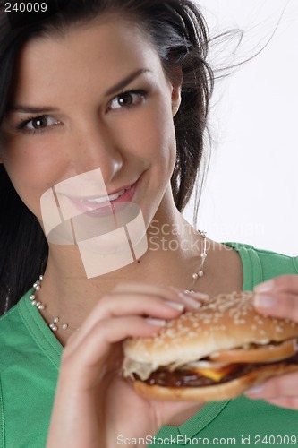 Image of Woman holding burger