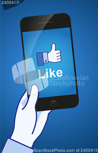 Image of Thumb Up. Like concept. A hand holding a mobile phone.