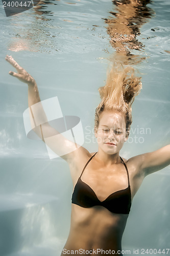 Image of pool diving woman