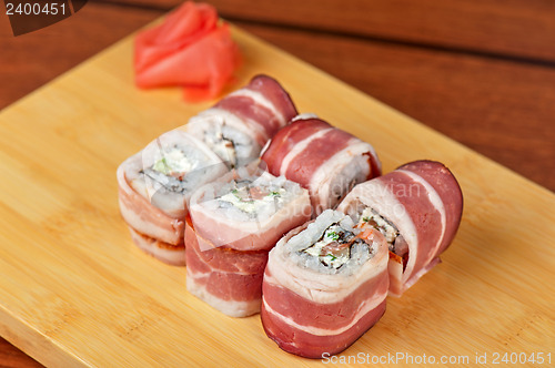 Image of Sushi roll with bacon