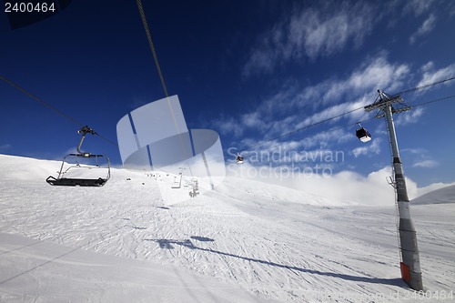 Image of Gondola and chair lift at nice sunny day