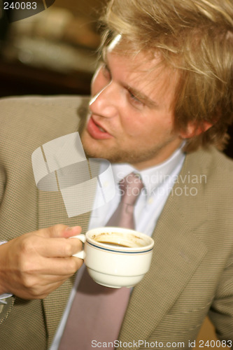 Image of Businessman drinking coffee