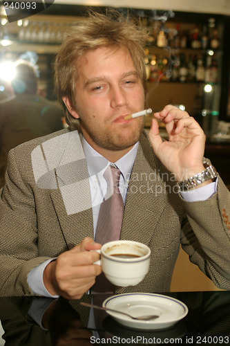 Image of Man drinking coffee