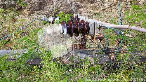 Image of Old electric pole fallen