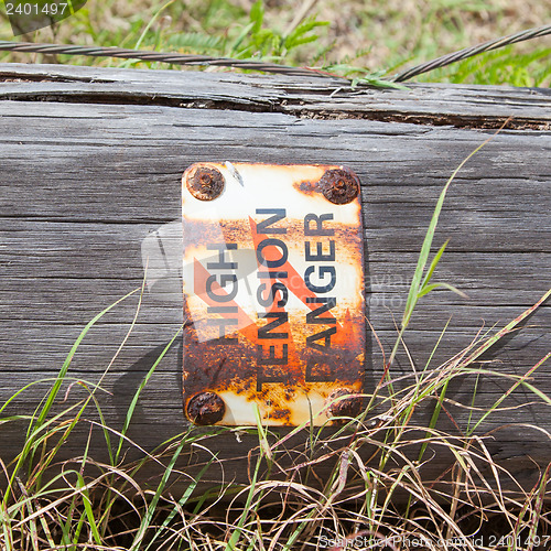 Image of High tension danger sign on a pole