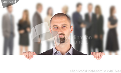 Image of Businessman showing blank empty white billboard sign