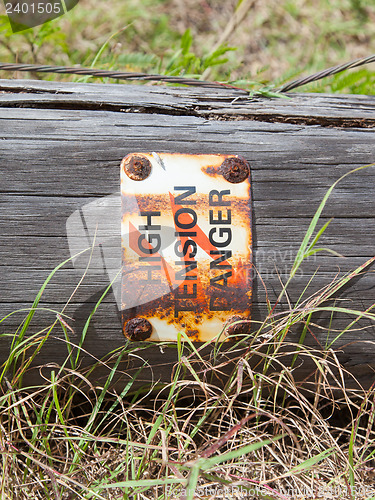 Image of High tension danger sign on a pole