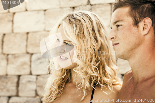 Image of young couple at the pool