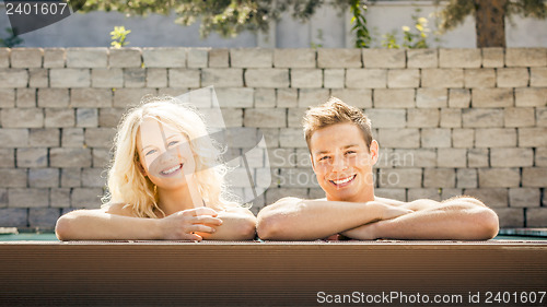 Image of young couple at the pool