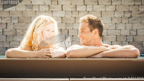 Image of young couple at the pool