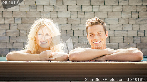 Image of young couple at the pool